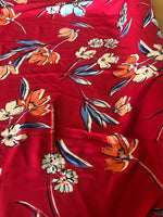 Floral Bunches on Red Crepe. 140g/m2, 100% Polyester. Roll Size: 5m