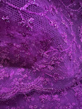 Close-up of purple lace fabric with intricate patterns