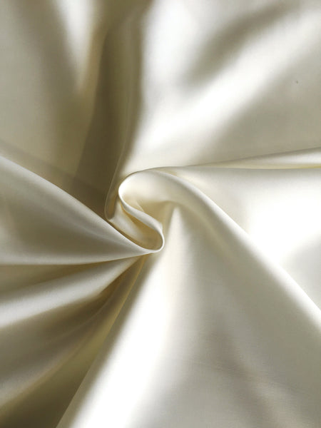 Ivory Pearl Finish Stretch Satin. 220g/m2, 98% Polyester 2% Elastane, 148cm. Roll Size: 1.4m