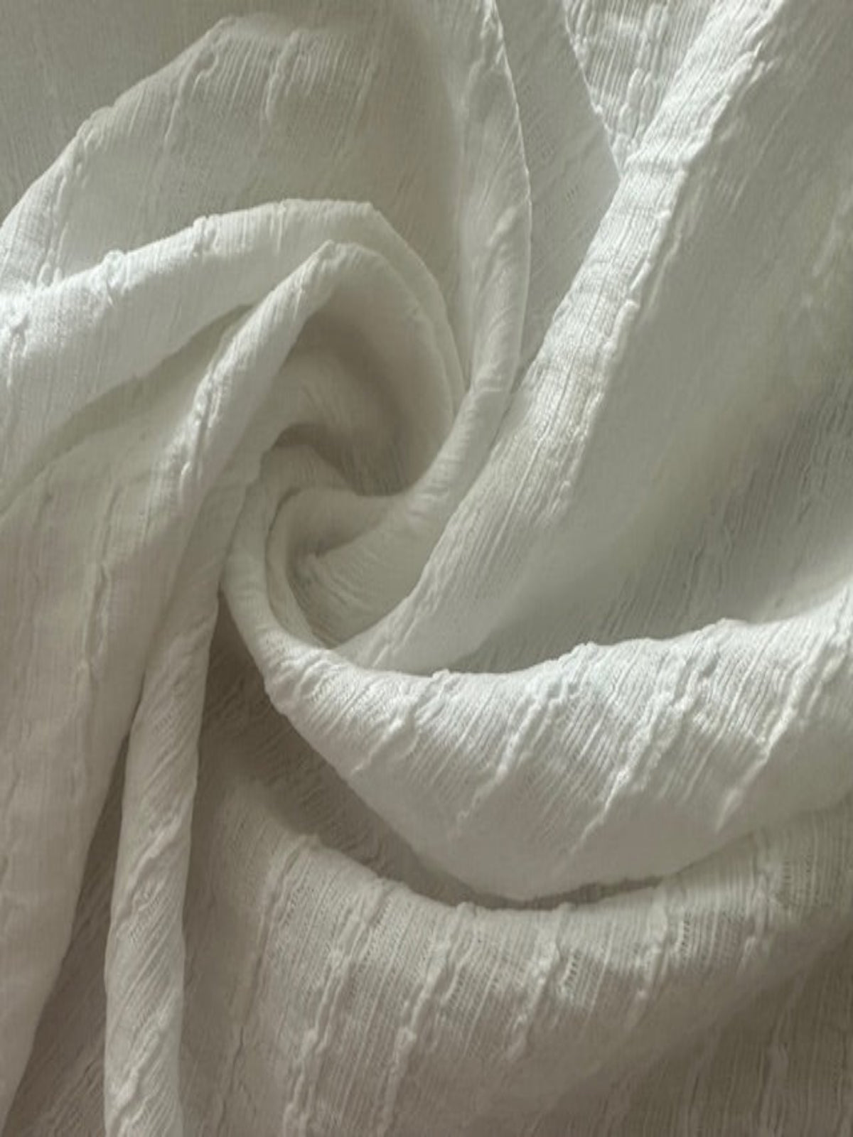 Ivory Textured Irregular Self Colour Stripe. Stripes run along the fabric.