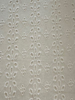 White Daisy Broderie Anglaise Running Along the Fabric