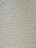 White Daisy Broderie Anglaise Running Along the Fabric