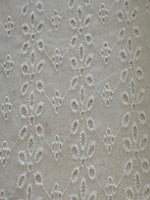 White Daisy Broderie Anglaise Running Along the Fabric