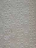 White Daisy Broderie Anglaise Running Along the Fabric