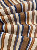 Bronze &amp; Blue Woven Stripe with Lurex Detail. One Way Stretch. Stripes run across the fabric.