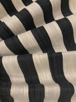 Black 2cm Stripe with Allover Gold Glitter Lurex Effect. Stripes run across the fabric.