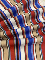 Blue/Red/Coffee Woven Cotton lightweight Stripe. Stripes run across the fabric.