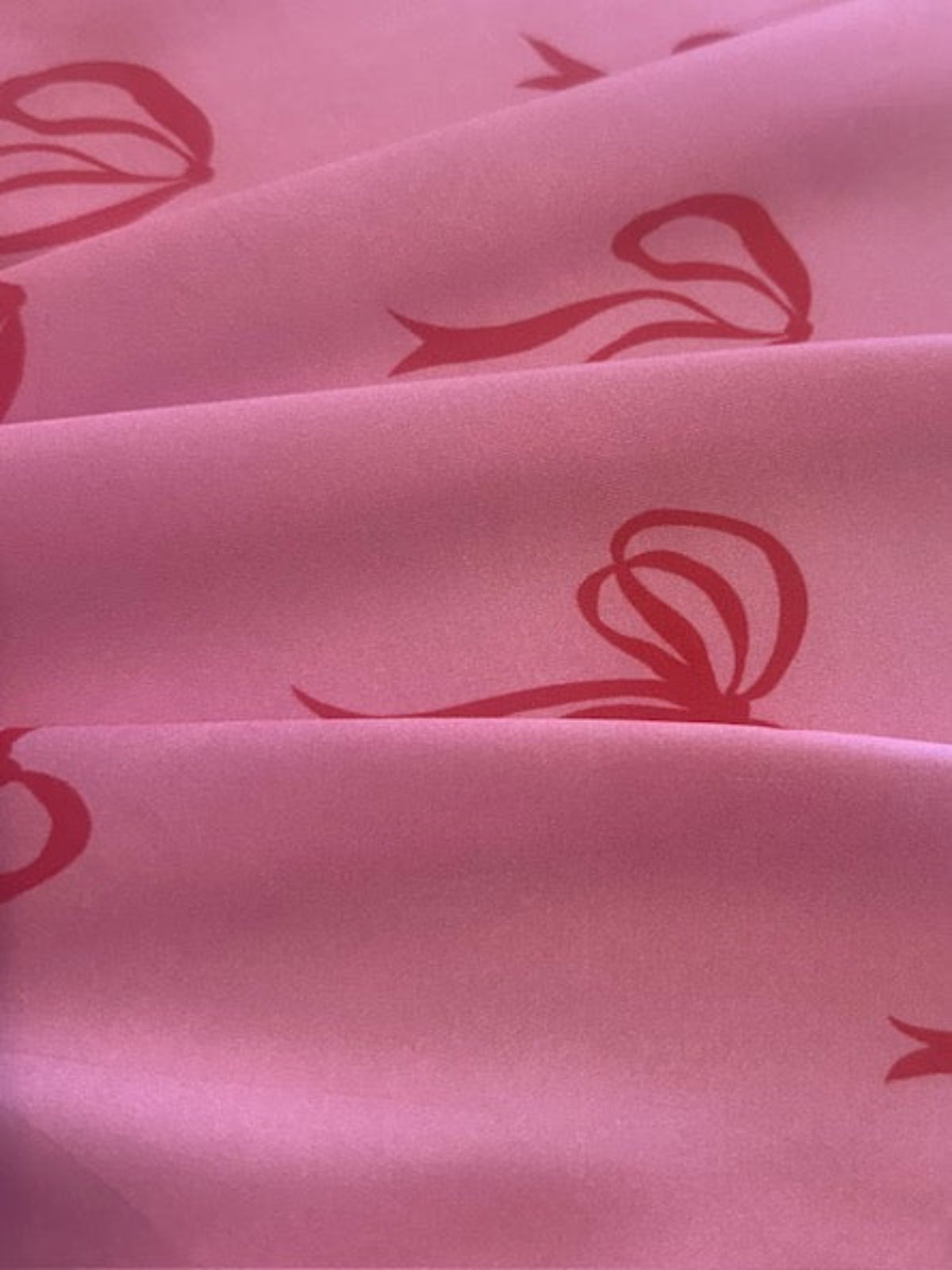 Red Bows on Bright Pink Satin Finish One Way Stretch Cotton