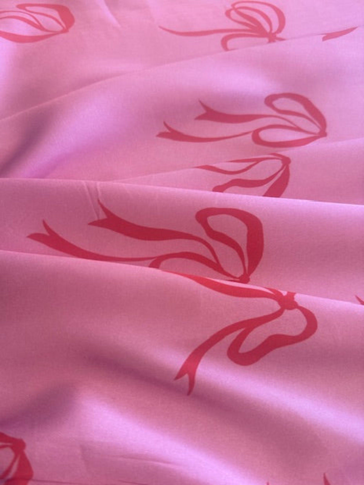 Red Bows on Bright Pink Satin Finish One Way Stretch Cotton