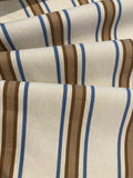 Brown/Blue Woven Stripe on Ivory. Stripes run across the fabric.