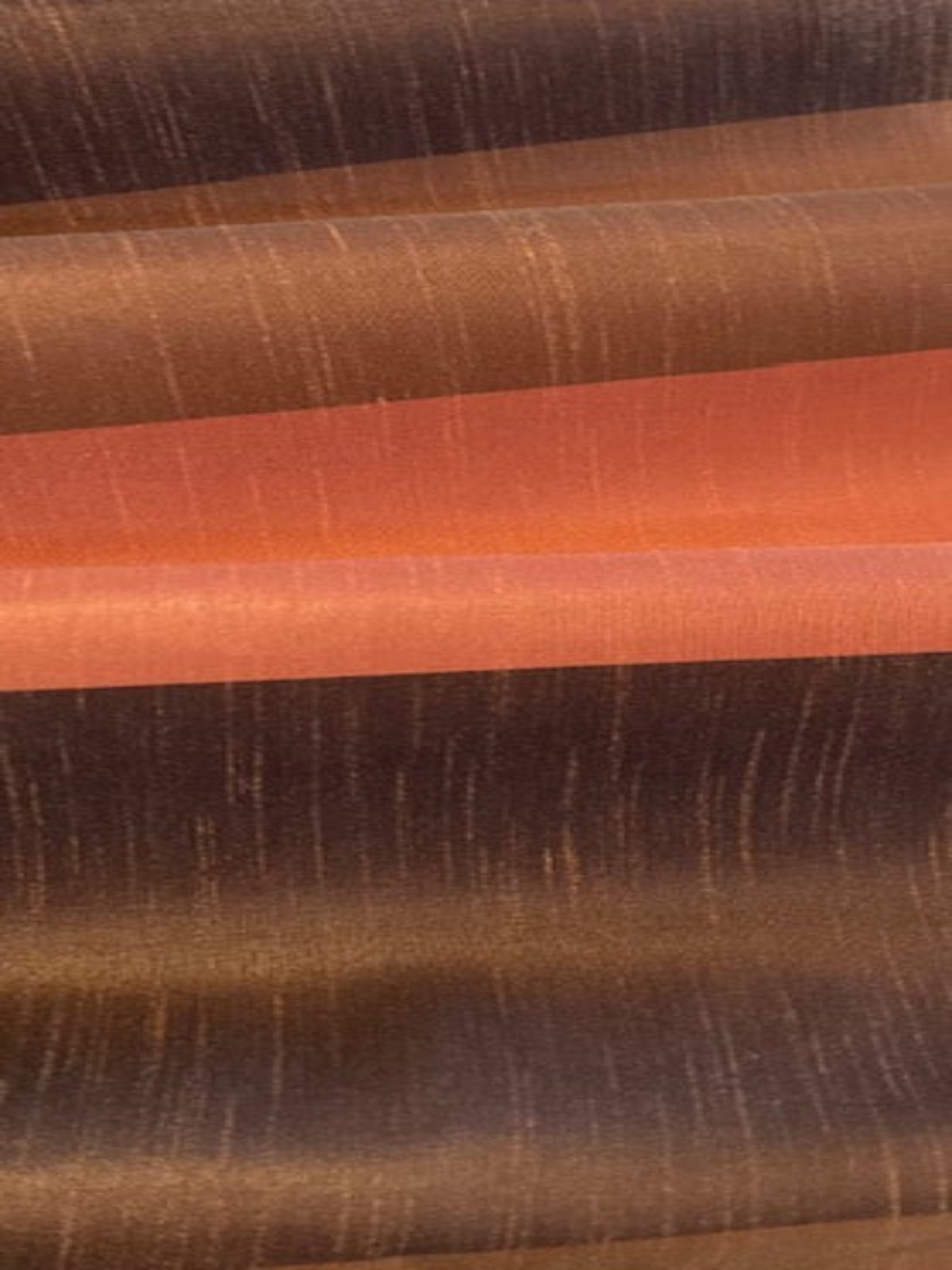 Brown/Brick Stripes on Dupion. Stripes run along the Fabric