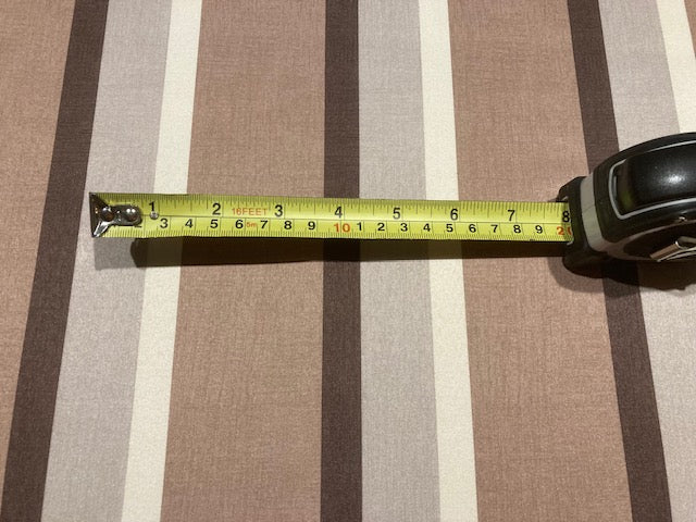 Coffee Tone Stripes. Stripes run along the fabric.