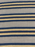 Blue Raised Stripe on Sky Blue with Bronze Lurex. Stripes run across the fabric. Lightweight.