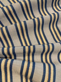 Blue Raised Stripe on Sky Blue with Bronze Lurex. Stripes run across the fabric. Lightweight.