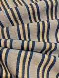 Blue Raised Stripe on Sky Blue with Bronze Lurex. Stripes run across the fabric. Lightweight.