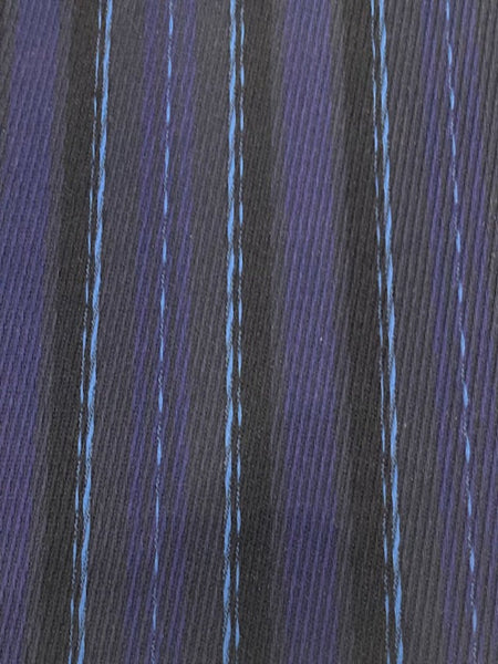 Navy/Pale Blue Stripe Raised Twill Suiting Weight. Stripes run along the fabric.