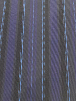 Navy/Pale Blue Stripe Raised Twill Suiting Weight. Stripes run along the fabric.