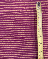 Fuchsia/Bronze Seersucker Stripe. Stripes run across the fabric.