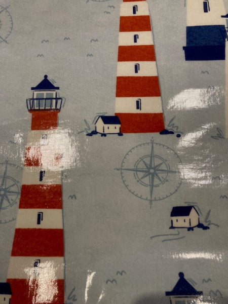 Red/Blue Lighthouses on Pale Blue PVC Coated Cotton