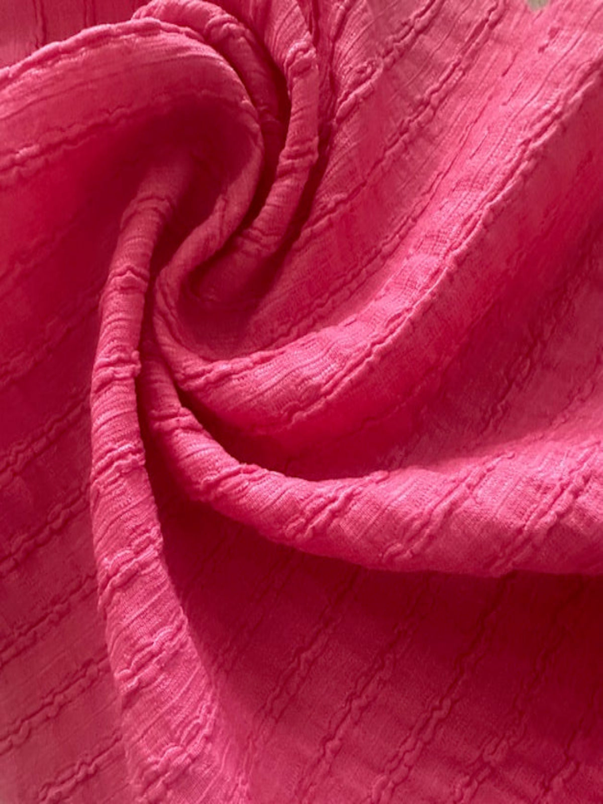 Bubble Pink Textured Irregular Self Colour Stripe. Stripes run along the fabric.