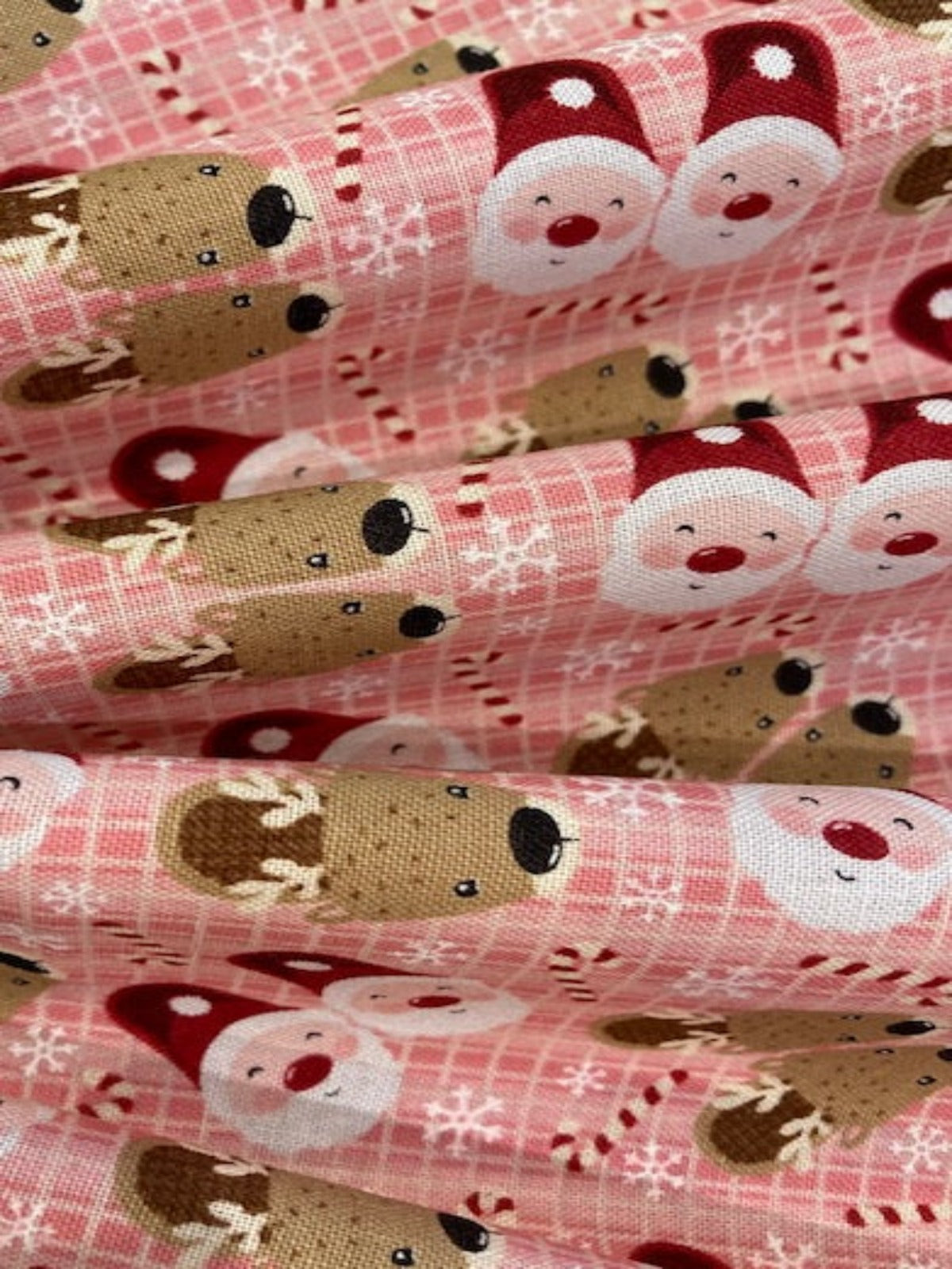Father Christmas & Reindeer on Pink Cotton Poplin