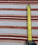 Red Raised Stripe on Sky Blue. Soft Handle,&nbsp; Stripes run across the fabric.