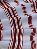 Red Raised Stripe on Sky Blue. Soft Handle,&nbsp; Stripes run across the fabric.