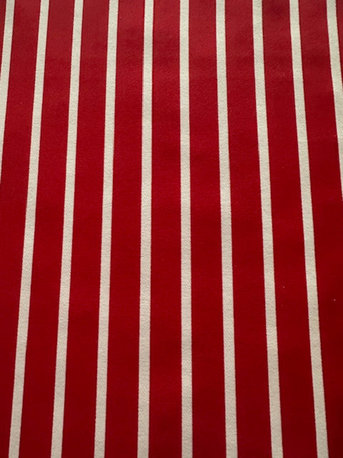 Red Butcher Stripe with stretch. Stripes run along the Fabric.