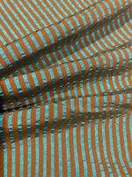 Sea Green/Burnt Orange seersucker Stripe with Sheen on the sea Green. Stripes run across the fabric.