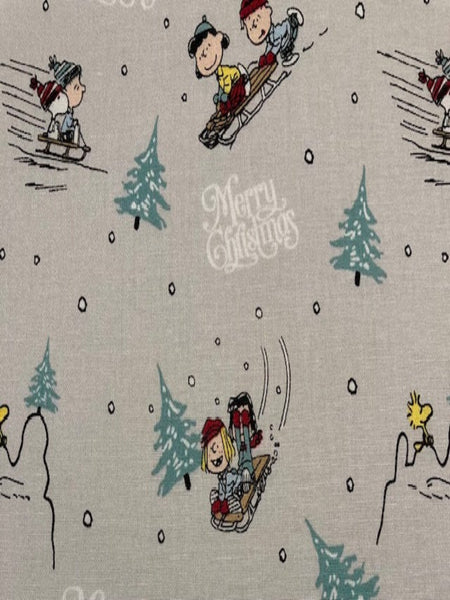 Snoopy on Christmas Sledge on Silver Cotton