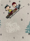 Snoopy on Christmas Sledge on Silver Cotton