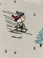 Snoopy on Christmas Sledge on Silver Cotton