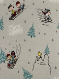 Snoopy on Christmas Sledge on Silver Cotton