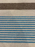 Blue/Brown Woven Stripe on Ivory with Silver Lurex Detail. Stripes run across the fabric.