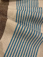 Blue/Brown Woven Stripe on Ivory with Silver Lurex Detail. Stripes run across the fabric.