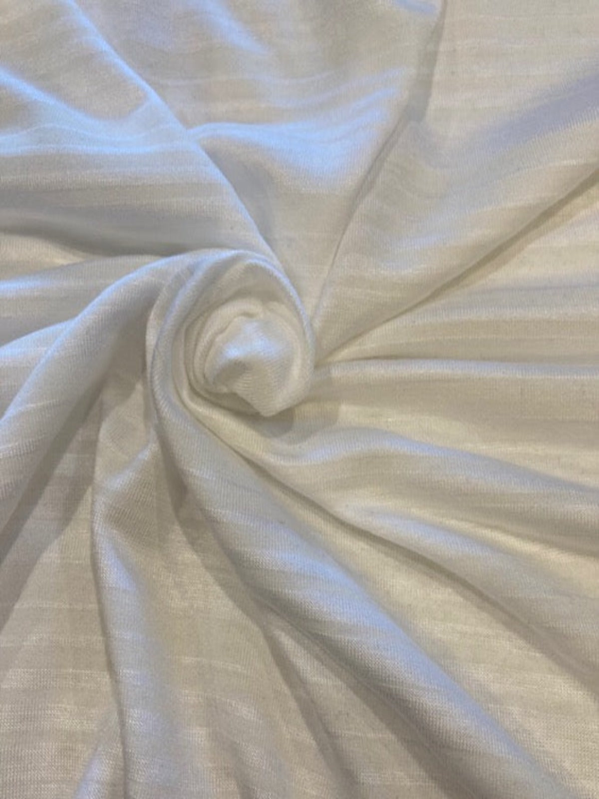 Pale Yellow/White Knitted Stripe. Stripes run across the fabric.