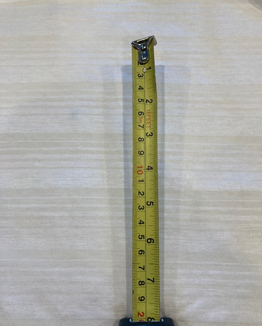 Pale Yellow/White Knitted Stripe. Stripes run across the fabric.