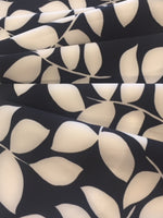 Ivory on Black Leaf Mono Print on Stretch Woven - Deadstock fabric on AmoThreads
