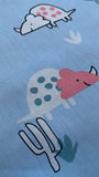 Smiling Dinosaurs on pale Blue Cotton Sateen - Deadstock fabric on AmoThreads