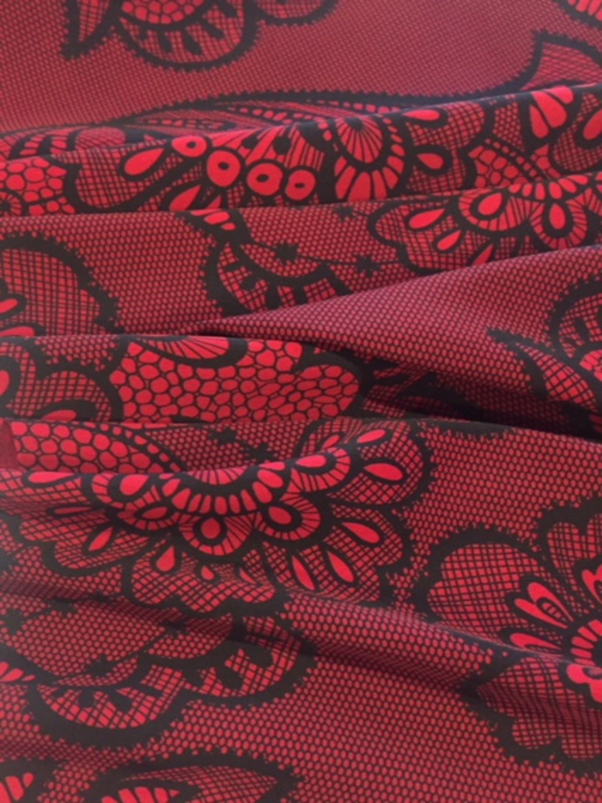 Red / Black Lace Look Print on stretch woven - Deadstock fabric on AmoThreads