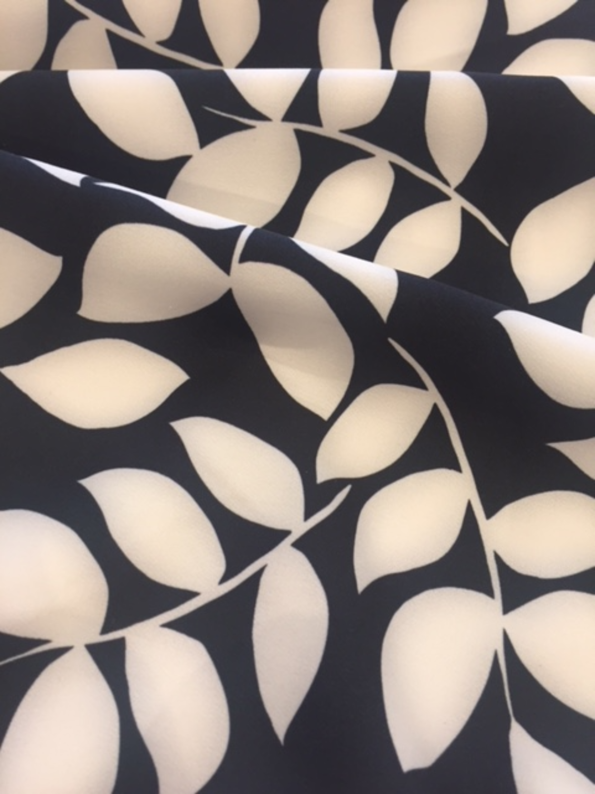 Ivory on Black Leaf Mono Print on Stretch Woven - Deadstock fabric on AmoThreads
