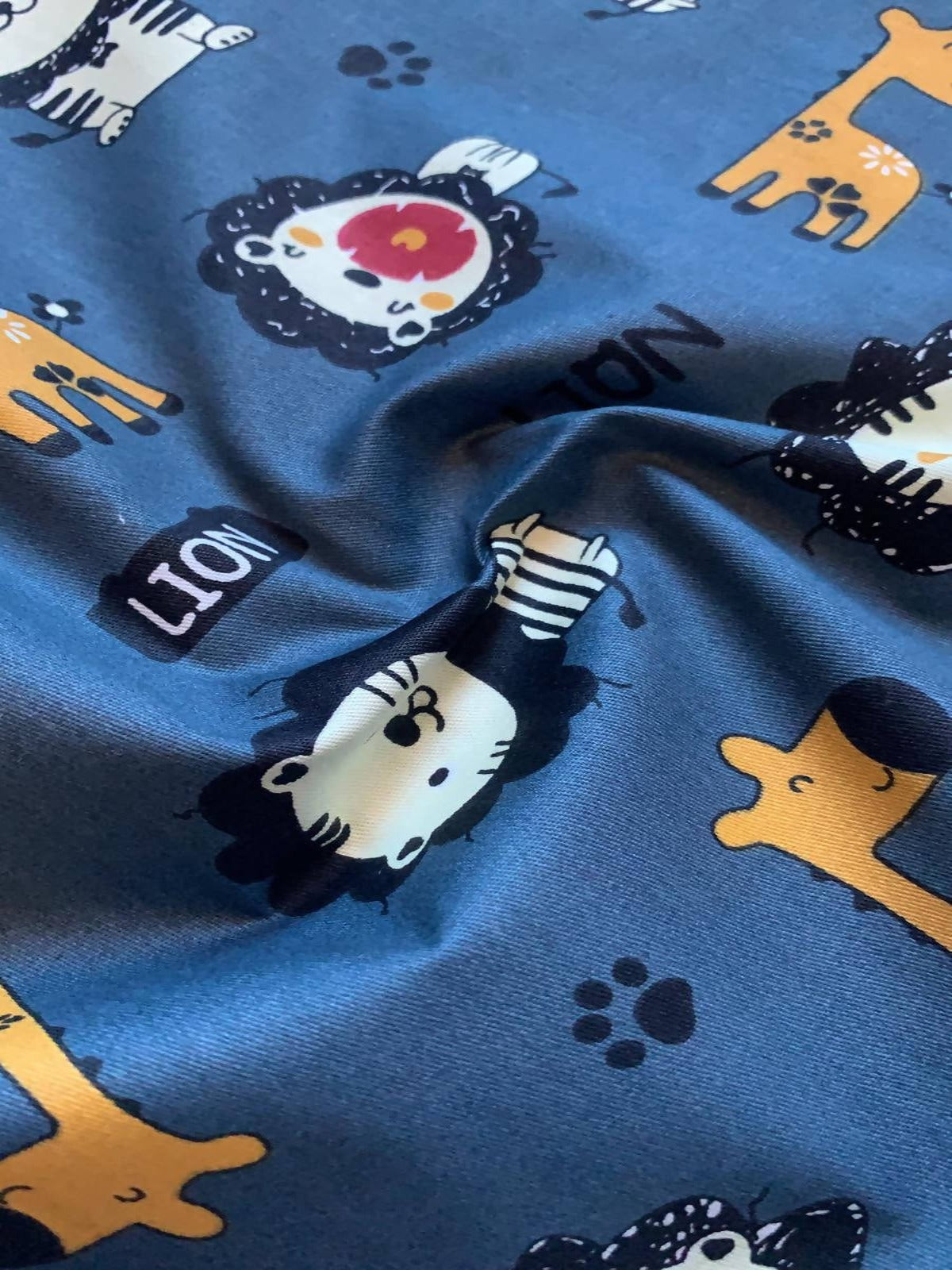 Lion and Giraffe on Teal Cotton Sateen - Deadstock fabric on AmoThreads