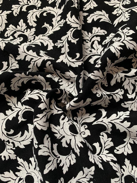White holly leaf print on black - Deadstock fabric on AmoThreads