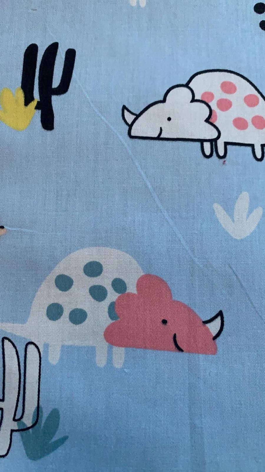 Smiling Dinosaurs on pale Blue Cotton Sateen - Deadstock fabric on AmoThreads