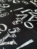 Number and Letters print on Black knit - Deadstock fabric on AmoThreads