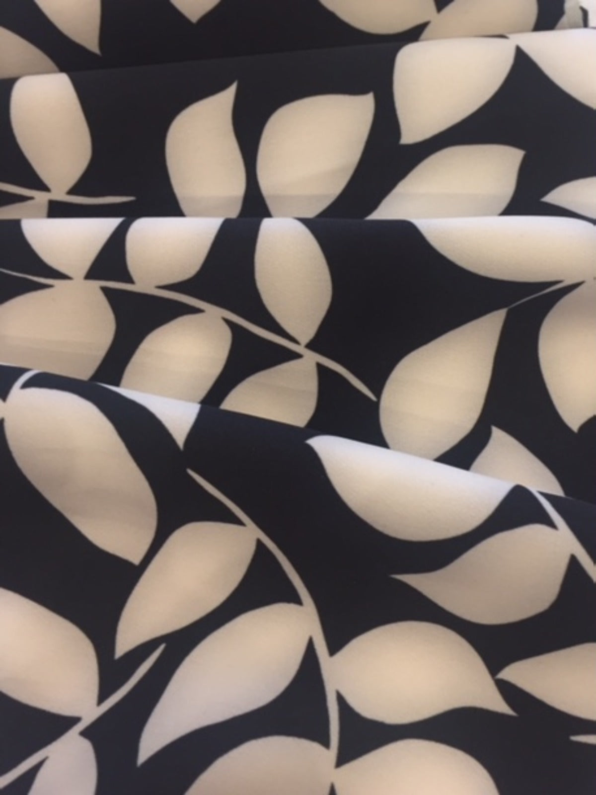 Ivory on Black Leaf Mono Print on Stretch Woven - Deadstock fabric on AmoThreads