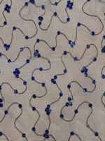 Iridescent Blue Sequin on Black Net