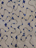 Iridescent Blue Sequin on Black Net