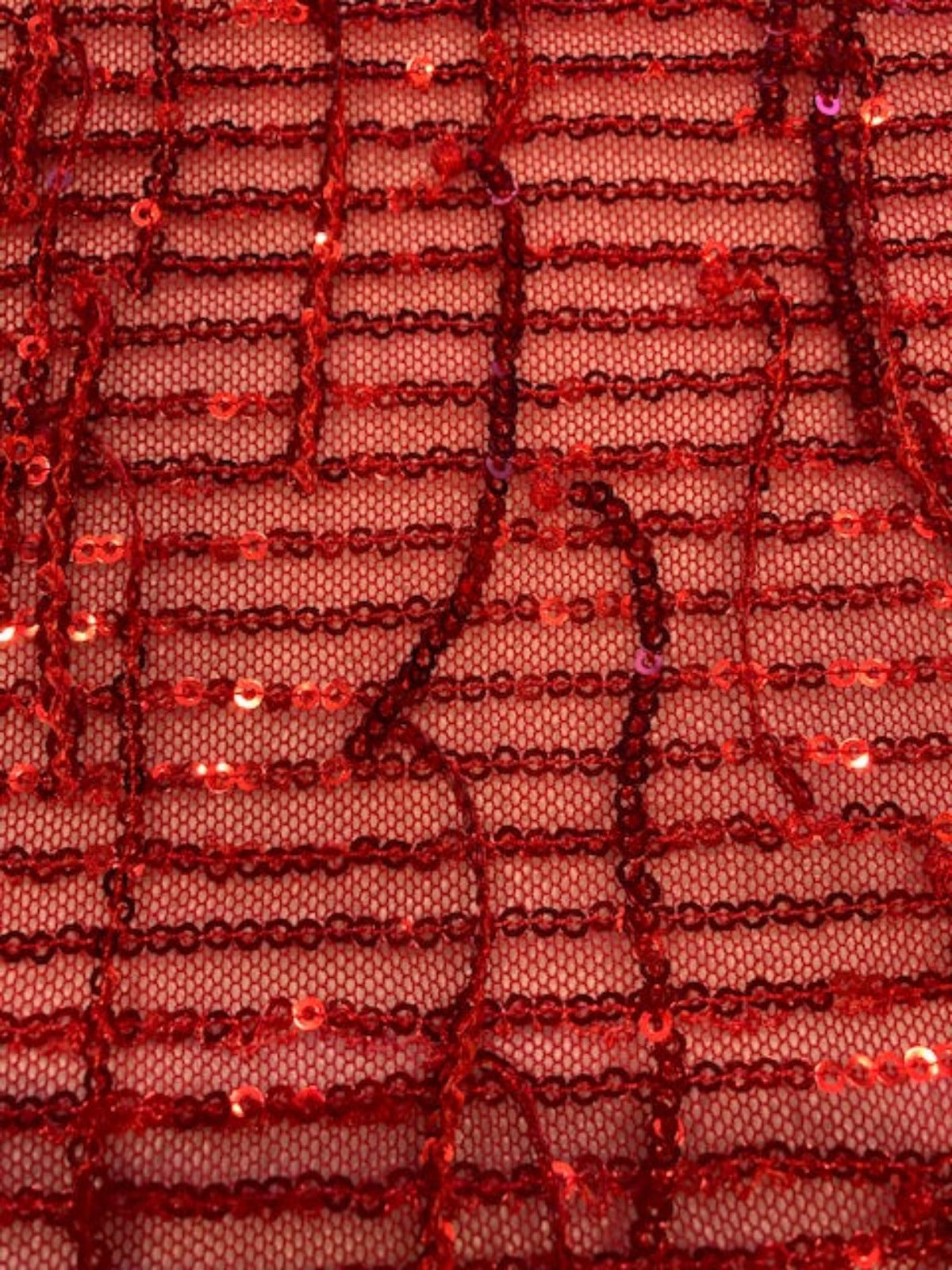 Red Sequin Tassel on Red Stretch Tulle. Tassels run across the piece.