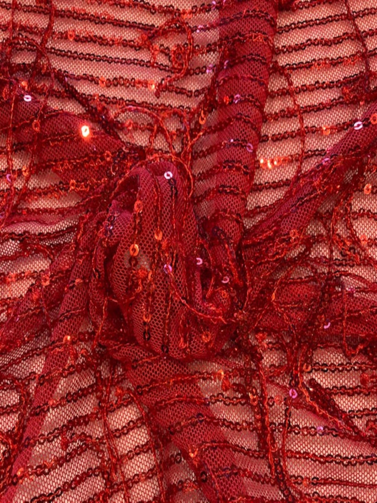 Red Sequin Tassel on Red Stretch Tulle. Tassels run across the piece.